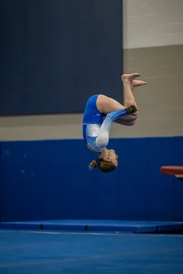 Gymnastics action shot — Homestead vs. Warsaw, Fort Wayne Indiana