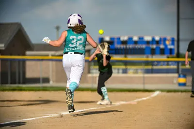Softball action shot — Lawn Stars vs. Saylors Concrete, Fort Wayne Indiana